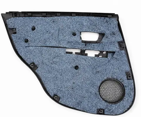 Automotive door trim panel with felt insulation backing